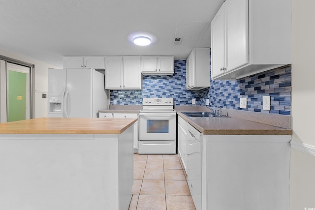 600 Deer Creek Rd Unit D, Surfside Beach, SC 29575 - kitchen featuring white appliances, a sink, white cabinets, and decorative backsplash