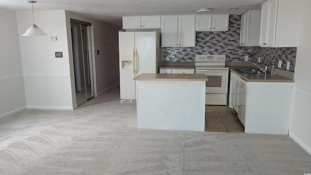600 Deer Creek Rd Unit D, Surfside Beach, SC 29575 - kitchen with white appliances, a sink, light colored carpet, white cabinets, and decorative backsplash