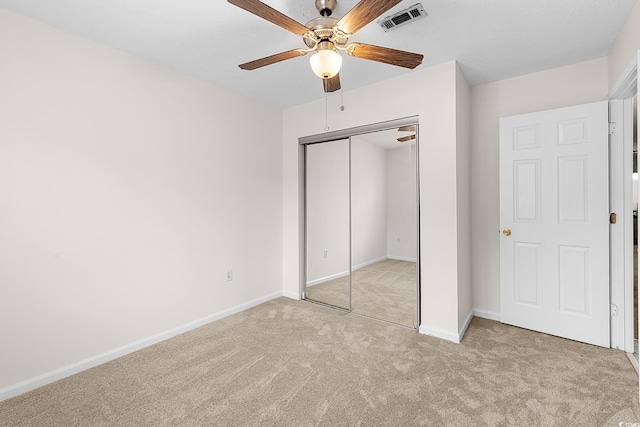 600 Deer Creek Rd Unit D, Surfside Beach, SC 29575 - unfurnished bedroom featuring carpet flooring, a closet, baseboards, and a ceiling fan
