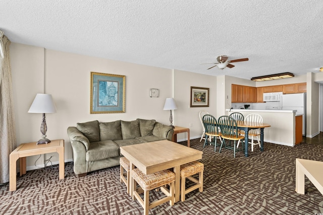 2500 N Ocean Blvd Unit 601, Myrtle Beach, SC 29577 - living room with a ceiling fan, dark colored carpet, a textured ceiling, and baseboards