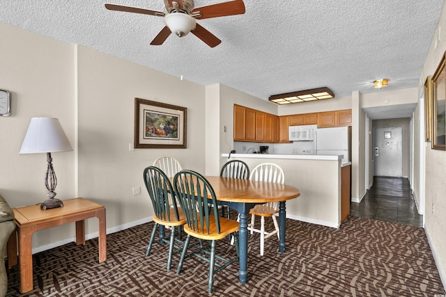 2500 N Ocean Blvd Unit 601, Myrtle Beach, SC 29577 - dining room with a ceiling fan, a textured ceiling, dark carpet, and baseboards