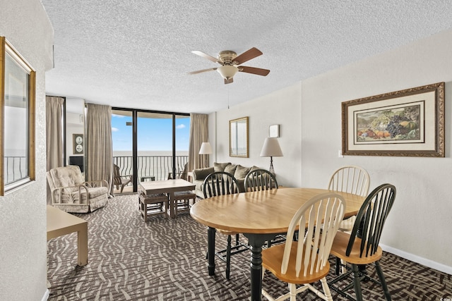 2500 N Ocean Blvd Unit 601, Myrtle Beach, SC 29577 - dining room featuring ceiling fan, carpet floors, floor to ceiling windows, a textured wall, and a textured ceiling