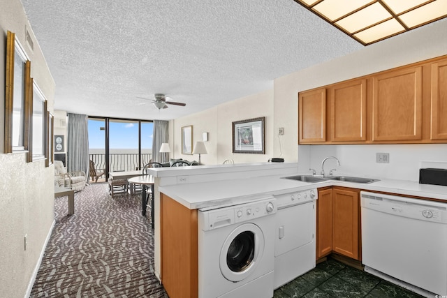 2500 N Ocean Blvd Unit 601, Myrtle Beach, SC 29577 - kitchen with white dishwasher, a ceiling fan, separate washer and dryer, a sink, and light countertops