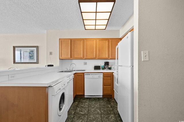 2500 N Ocean Blvd Unit 601, Myrtle Beach, SC 29577 - kitchen with white appliances, a sink, washer / clothes dryer, a textured ceiling, and light countertops