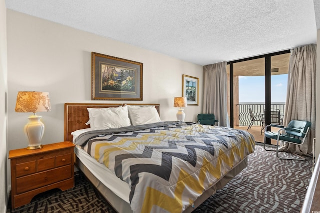 2500 N Ocean Blvd Unit 601, Myrtle Beach, SC 29577 - bedroom featuring access to outside, a textured ceiling, and carpet flooring