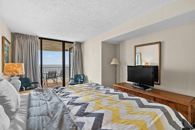 2500 N Ocean Blvd Unit 601, Myrtle Beach, SC 29577 - bedroom with access to outside and a textured ceiling