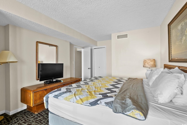 2500 N Ocean Blvd Unit 601, Myrtle Beach, SC 29577 - bedroom featuring a textured ceiling, baseboards, and a closet