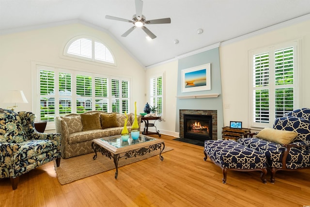 1325 Clipper Dr, North Myrtle Beach, SC 29582 - living room with wood finished floors, a fireplace with flush hearth, a ceiling fan, lofted ceiling, and ornamental molding