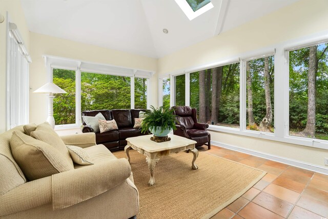 1325 Clipper Dr, North Myrtle Beach, SC 29582 - sunroom / solarium featuring a skylight, high vaulted ceiling, and baseboards