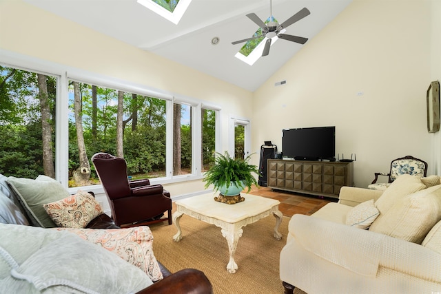 1325 Clipper Dr, North Myrtle Beach, SC 29582 - living room featuring a skylight, high vaulted ceiling, ceiling fan, beamed ceiling, and tile patterned flooring