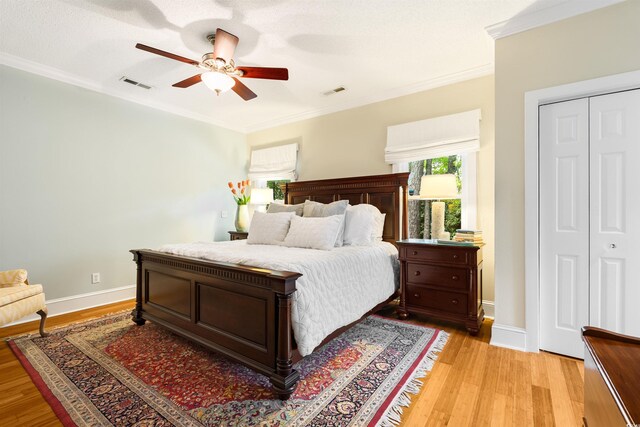 1325 Clipper Dr, North Myrtle Beach, SC 29582 - bedroom featuring light wood-style floors, crown molding, ceiling fan, and baseboards