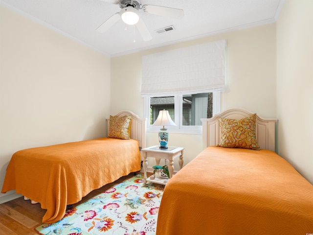 1325 Clipper Dr, North Myrtle Beach, SC 29582 - bedroom featuring wood finished floors, crown molding, and ceiling fan
