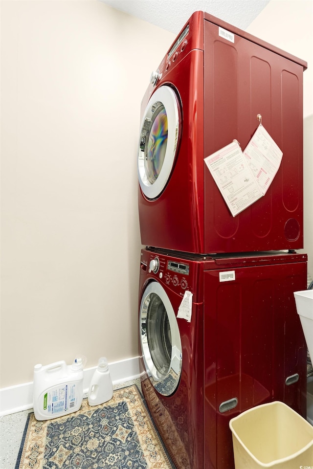 1325 Clipper Dr, North Myrtle Beach, SC 29582 - laundry area featuring estacked washer and dryer and baseboards