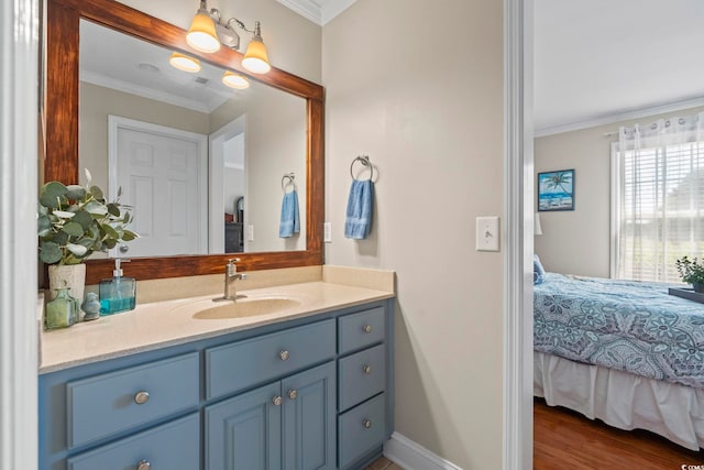 1609 Bridgebrook Ln, Conway, SC 29527 - ensuite bathroom with vanity, ornamental molding, baseboards, and wood finished floors