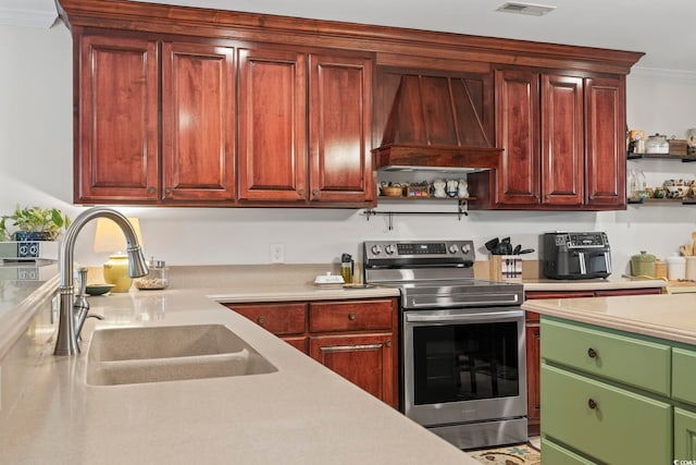 1609 Bridgebrook Ln, Conway, SC 29527 - kitchen with stainless steel electric range oven, a sink, light countertops, crown molding, and premium range hood