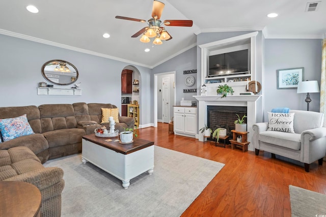 1609 Bridgebrook Ln, Conway, SC 29527 - living area with wood finished floors, a ceiling fan, lofted ceiling, crown molding, and a fireplace