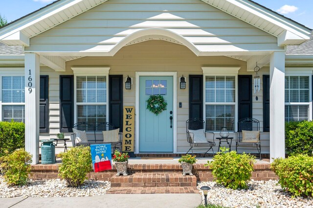1609 Bridgebrook Ln, Conway, SC 29527 - entrance to property featuring a porch and a shingled roof