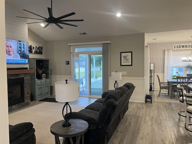 2529 Suzanne Dr, Conway, SC 29526 - living room featuring wainscoting, wood finished floors, vaulted ceiling, a decorative wall, and a chandelier