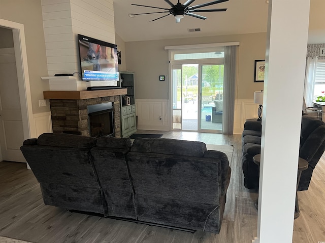 2529 Suzanne Dr, Conway, SC 29526 - living room featuring ceiling fan, wainscoting, wood finished floors, a fireplace, and a decorative wall