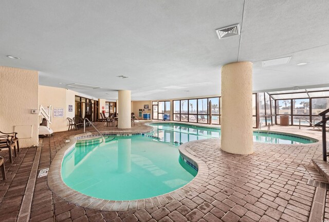 7100 N Ocean Blvd N Unit 601, Myrtle Beach, SC 29572 - indoor pool with a patio and a lanai