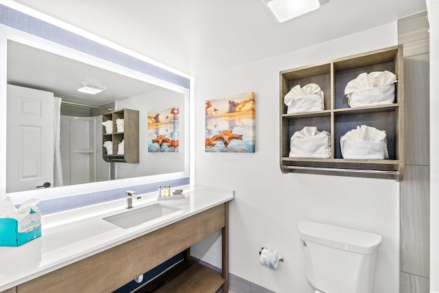 7100 N Ocean Blvd N Unit 601, Myrtle Beach, SC 29572 - bathroom with toilet, vanity, and baseboards