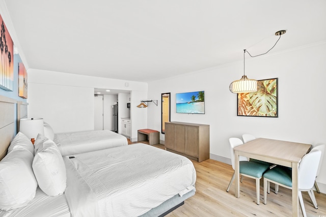 7100 N Ocean Blvd N Unit 601, Myrtle Beach, SC 29572 - bedroom with light wood-style flooring and crown molding
