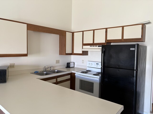 1930 Bent Grass Dr Unit 39H, Surfside Beach, SC 29575 - kitchen featuring black appliances, light countertops, a sink, under cabinet range hood, and white cabinetry