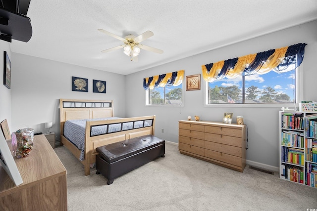 775 Plantation Dr Unit 28, Little River, SC 29566 - bedroom with light colored carpet, ceiling fan, and a textured ceiling