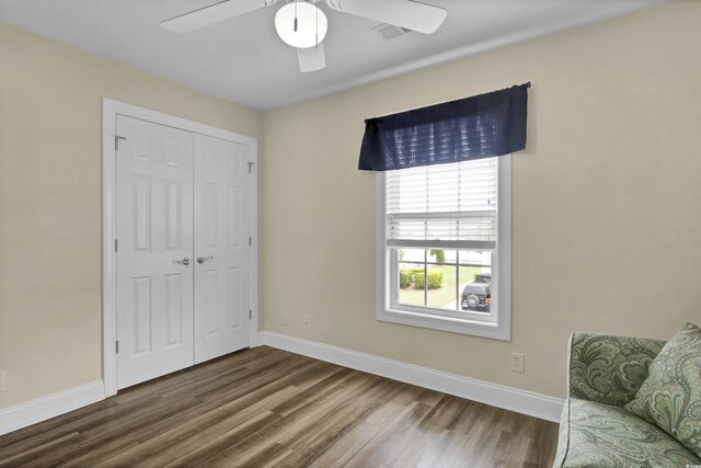 8855 Radcliff Dr NW Unit 53C, Calabash, NC 28467 - bedroom featuring wood finished floors, baseboards, a closet, and a ceiling fan