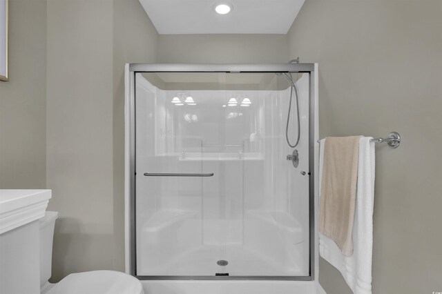 8855 Radcliff Dr NW Unit 53C, Calabash, NC 28467 - bathroom featuring a stall shower and toilet