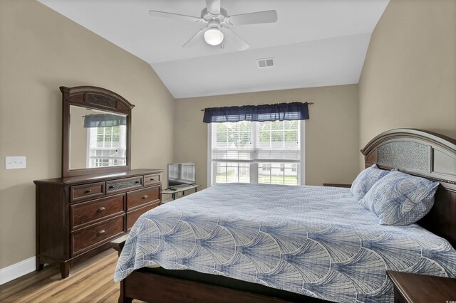 8855 Radcliff Dr NW Unit 53C, Calabash, NC 28467 - bedroom with vaulted ceiling, light wood-style floors, baseboards, and a ceiling fan