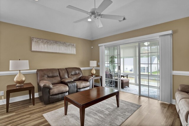 8855 Radcliff Dr NW Unit 53C, Calabash, NC 28467 - living room featuring wood finished floors, a ceiling fan, baseboards, and vaulted ceiling