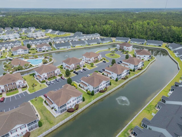8855 Radcliff Dr NW Unit 53C, Calabash, NC 28467 - aerial overview of property's location with a forest, nearby suburban area, and a large body of water