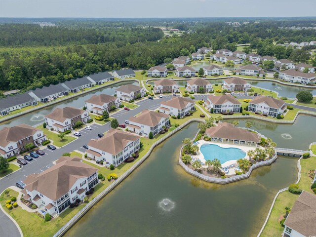 8855 Radcliff Dr NW Unit 53C, Calabash, NC 28467 - aerial perspective of suburban area with a nearby body of water and a pool area