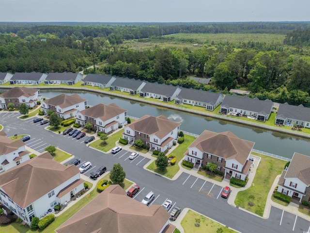 8855 Radcliff Dr NW Unit 53C, Calabash, NC 28467 - aerial perspective of suburban area featuring a nearby body of water and a forest