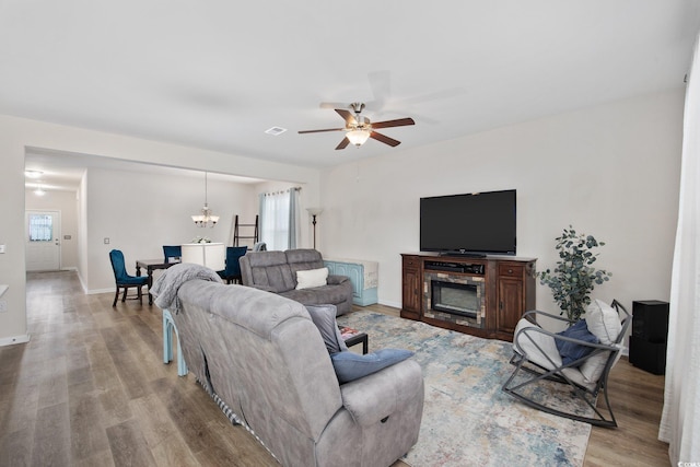 924 Sorano St, Myrtle Beach, SC 29579 - living room featuring light wood finished floors, a ceiling fan, and a chandelier
