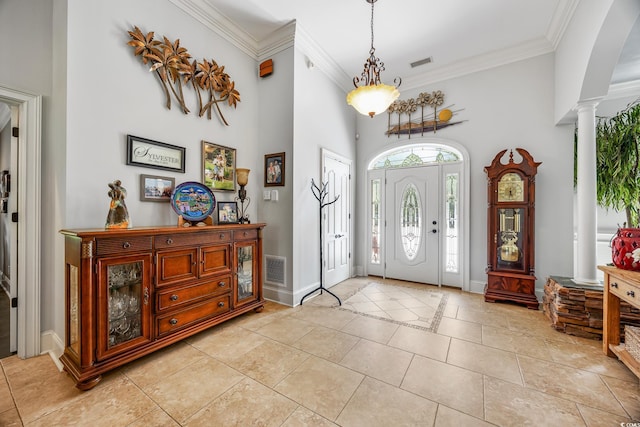 784 Caines Landing Rd, Conway, SC 29526 - foyer with ornate columns, a towering ceiling, baseboards, ornamental molding, and light tile patterned floors