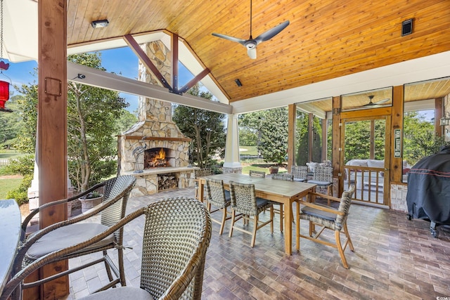 784 Caines Landing Rd, Conway, SC 29526 - sunroom featuring an outdoor stone fireplace, ceiling fan, outdoor dining space, and lofted ceiling