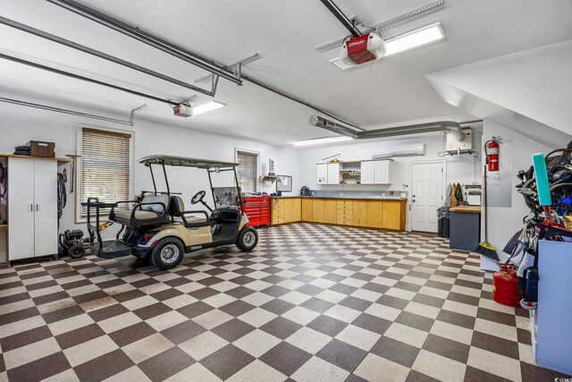 784 Caines Landing Rd, Conway, SC 29526 - garage featuring an AC wall unit and a garage door opener