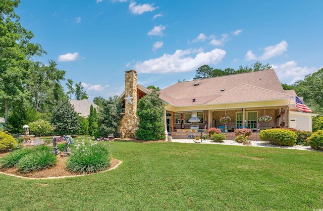 784 Caines Landing Rd, Conway, SC 29526 - back of house with a patio, a lawn, brick siding, and roof with shingles