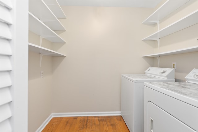 814 Night Heron Ln, Myrtle Beach, SC 29572 - laundry area with washing machine and dryer, wood finished floors, and baseboards