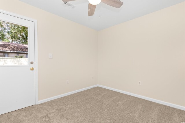 814 Night Heron Ln, Myrtle Beach, SC 29572 - spare room featuring light carpet, a ceiling fan, and baseboards