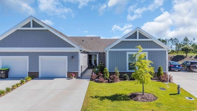 4053 Taranto Loop Unit C, Myrtle Beach, SC 29579 - view of front facade with a front yard, driveway, a garage, a gate, and brick siding