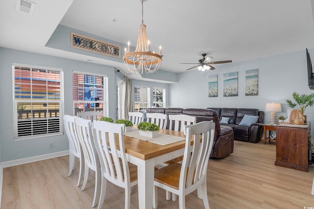 3401 N Ocean Blvd Unit 110, North Myrtle Beach, SC 29582 - dining room with light wood-style floors, a chandelier, ceiling fan, and baseboards