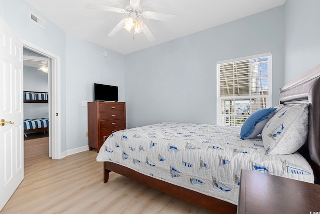 3401 N Ocean Blvd Unit 110, North Myrtle Beach, SC 29582 - bedroom featuring wood finished floors, baseboards, and ceiling fan