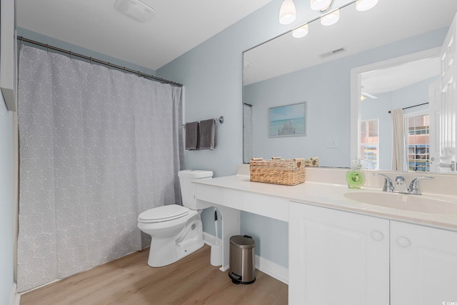 3401 N Ocean Blvd Unit 110, North Myrtle Beach, SC 29582 - full bathroom featuring toilet, wood finished floors, and vanity