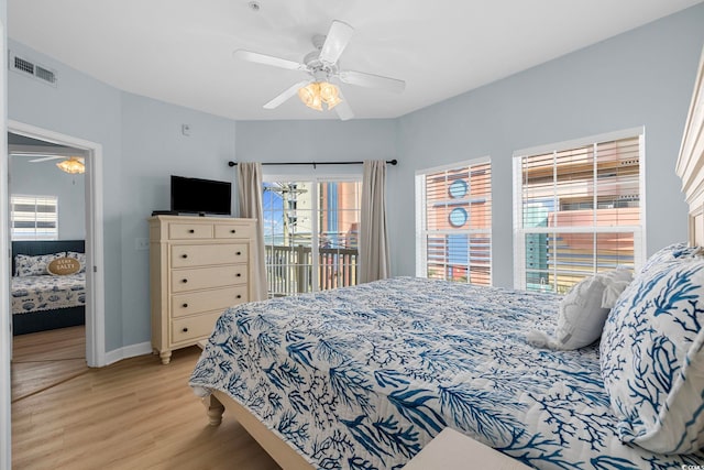3401 N Ocean Blvd Unit 110, North Myrtle Beach, SC 29582 - bedroom with access to exterior, light wood-type flooring, baseboards, and ceiling fan