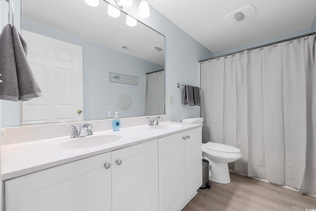 3401 N Ocean Blvd Unit 110, North Myrtle Beach, SC 29582 - full bath with toilet, double vanity, and wood finished floors