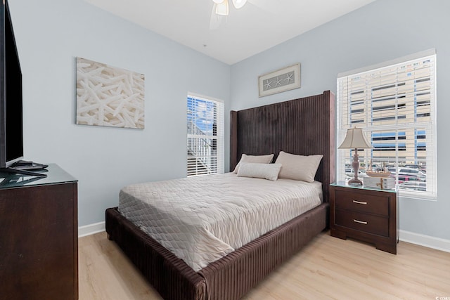 3401 N Ocean Blvd Unit 110, North Myrtle Beach, SC 29582 - bedroom with light wood-style floors, baseboards, and a ceiling fan