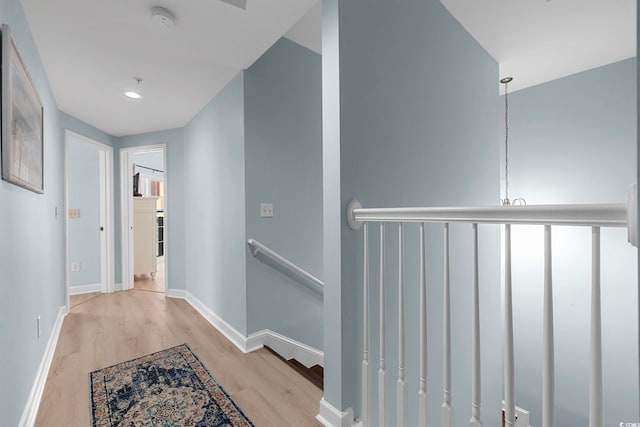 3401 N Ocean Blvd Unit 110, North Myrtle Beach, SC 29582 - corridor featuring an upstairs landing, wood finished floors, baseboards, and recessed lighting